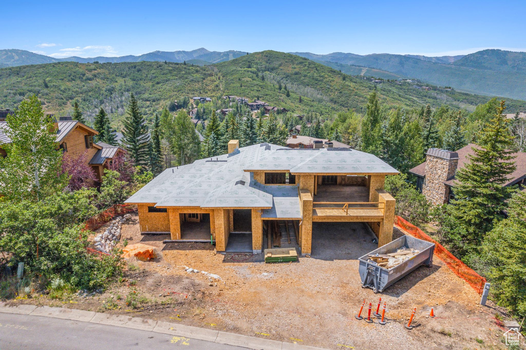 Birds eye view of property featuring a mountain view