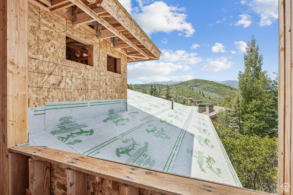 Wooden terrace featuring a mountain view