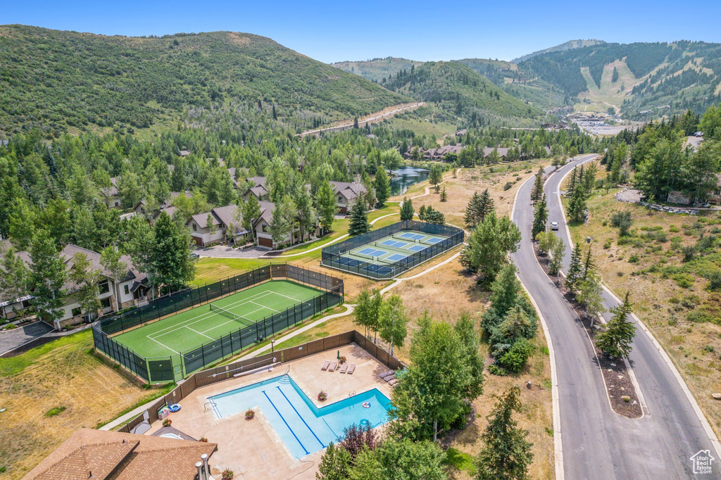 Birds eye view of property with a mountain view