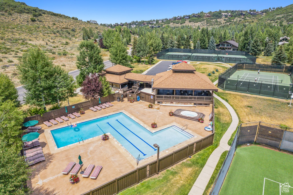 View of swimming pool with a patio