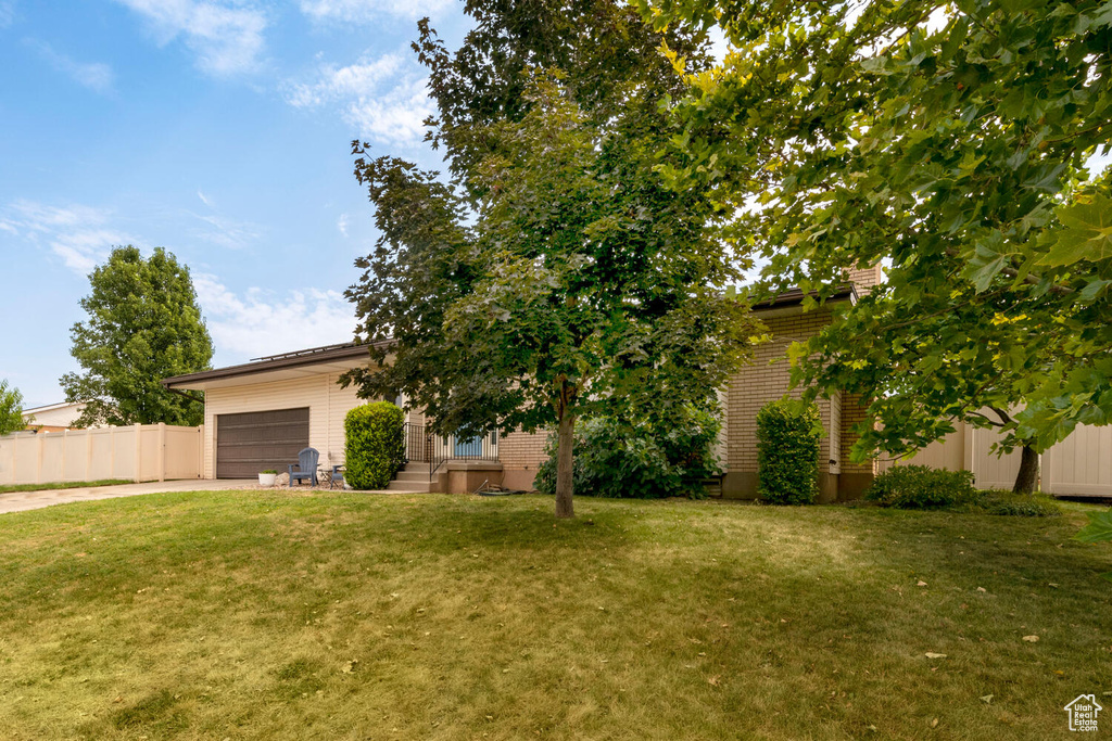 View of yard with a garage