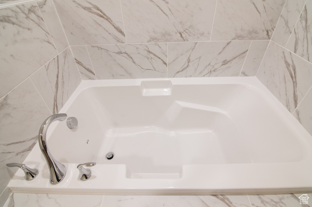 Bathroom with a relaxing tiled tub