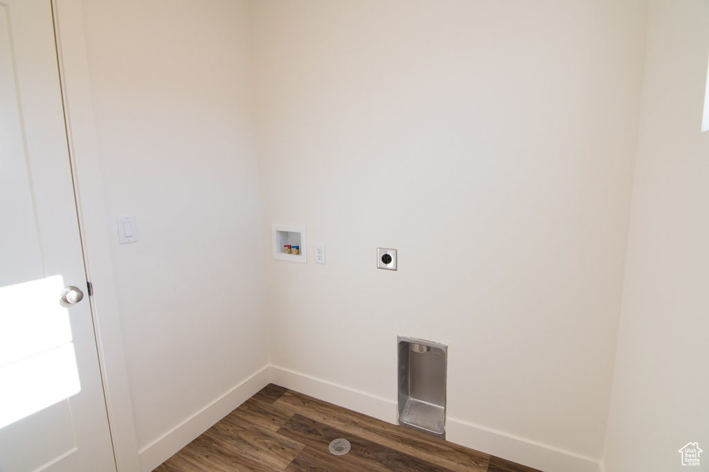 Washroom with hookup for a washing machine, hookup for an electric dryer, and dark hardwood / wood-style floors