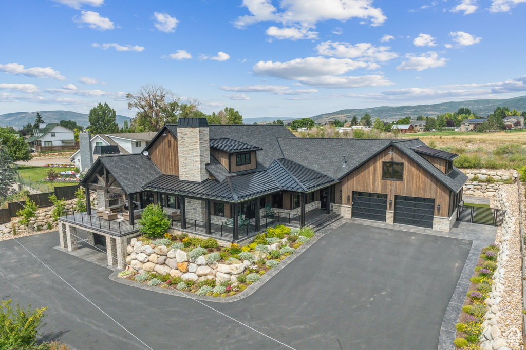 View of front facade featuring a mountain view and a garage