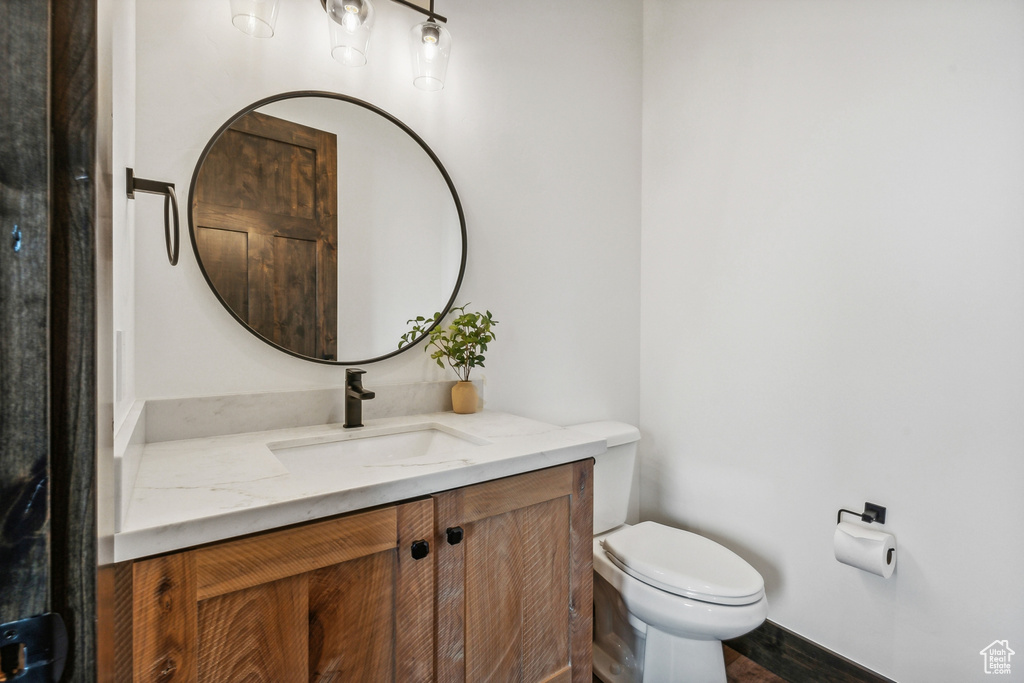 Bathroom featuring vanity and toilet