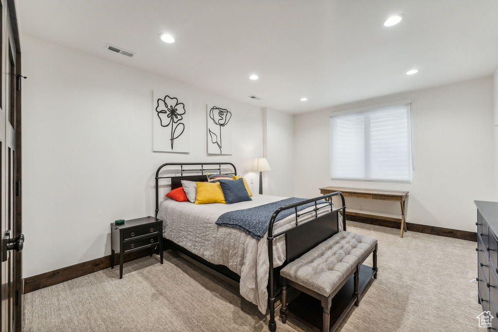 Bedroom with light carpet