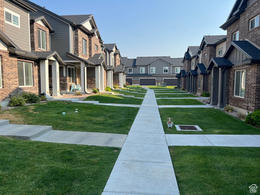 View of home\'s community featuring a lawn