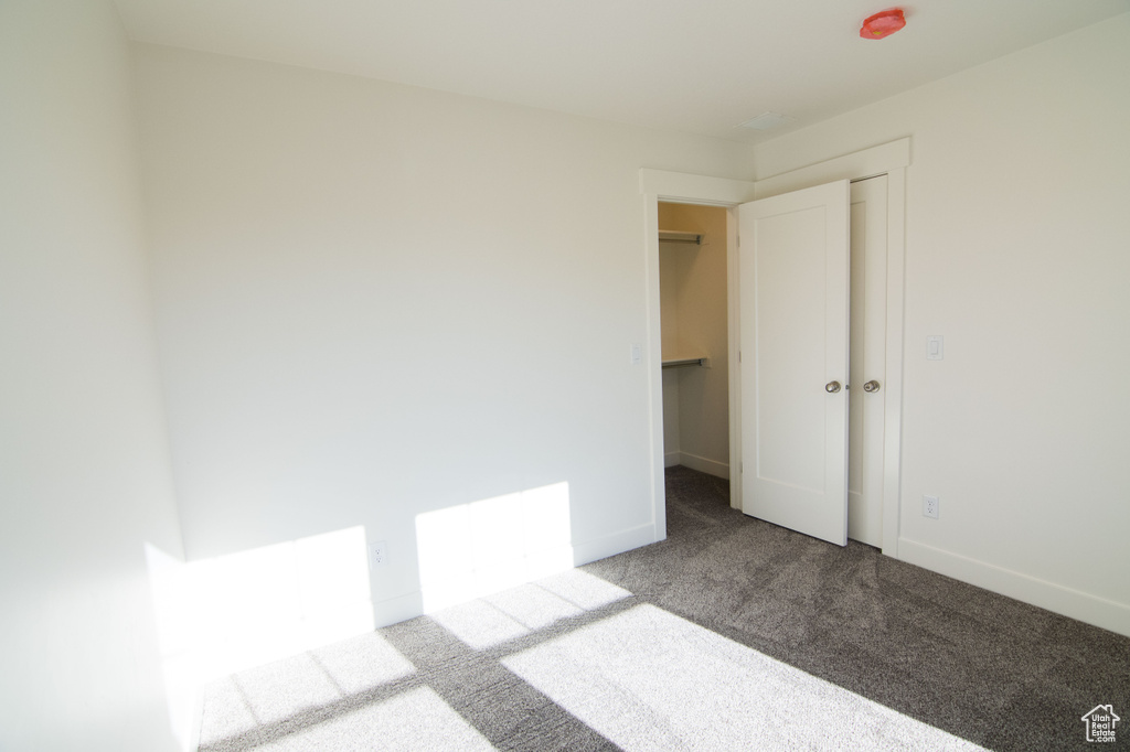 Unfurnished room featuring carpet floors