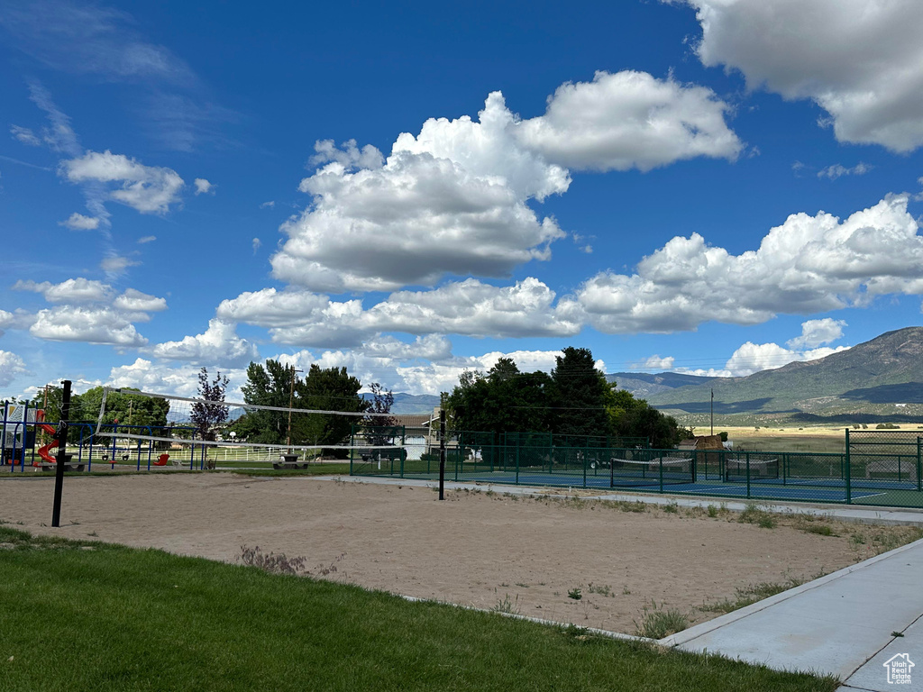 View of home's community featuring volleyball court and a mountain view