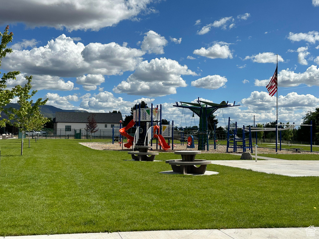 View of play area with a yard