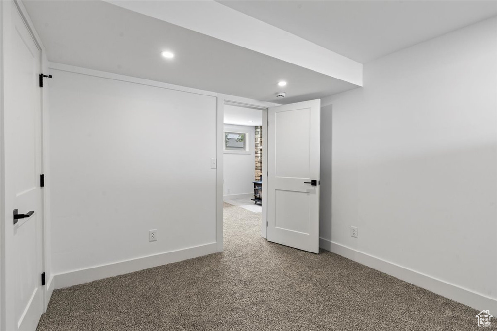 Basement featuring carpet