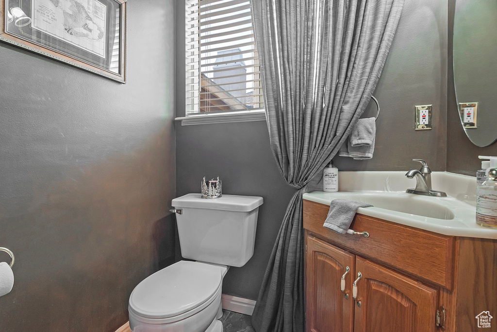 Bathroom featuring vanity and toilet