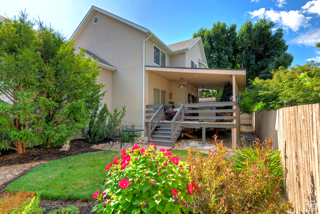 Back of house with a wooden deck