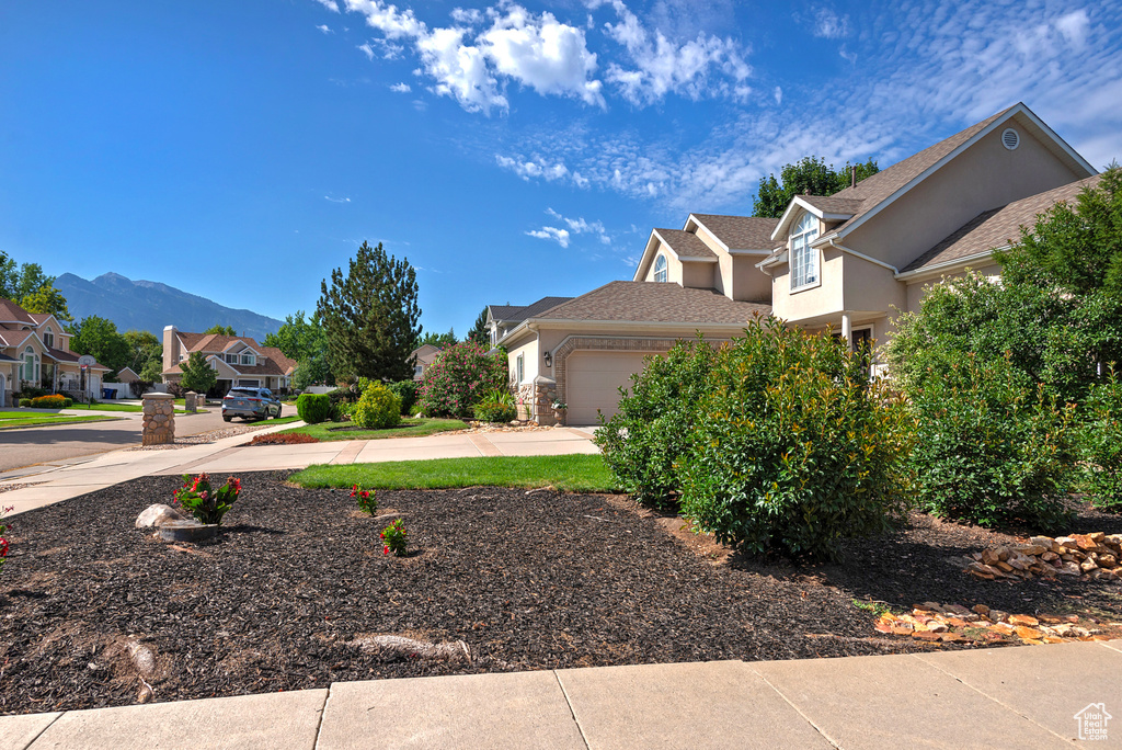 Exterior space featuring a mountain view and a garage