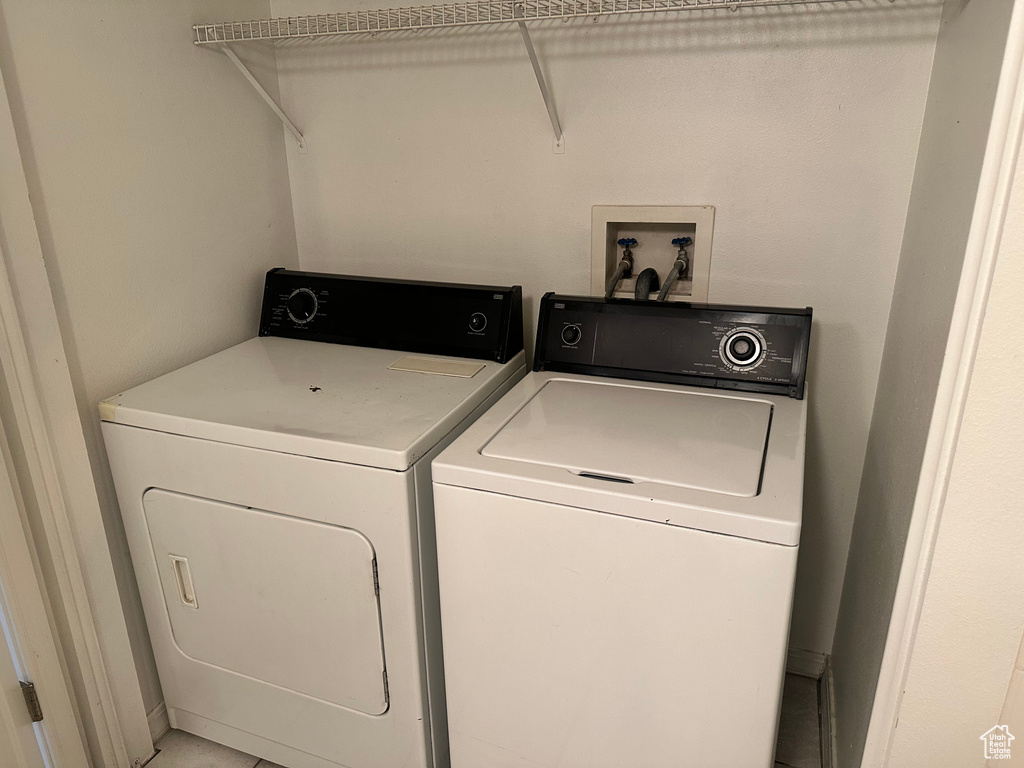 Clothes washing area with washer and clothes dryer