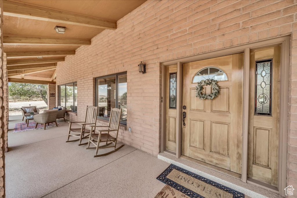 Property entrance featuring covered porch