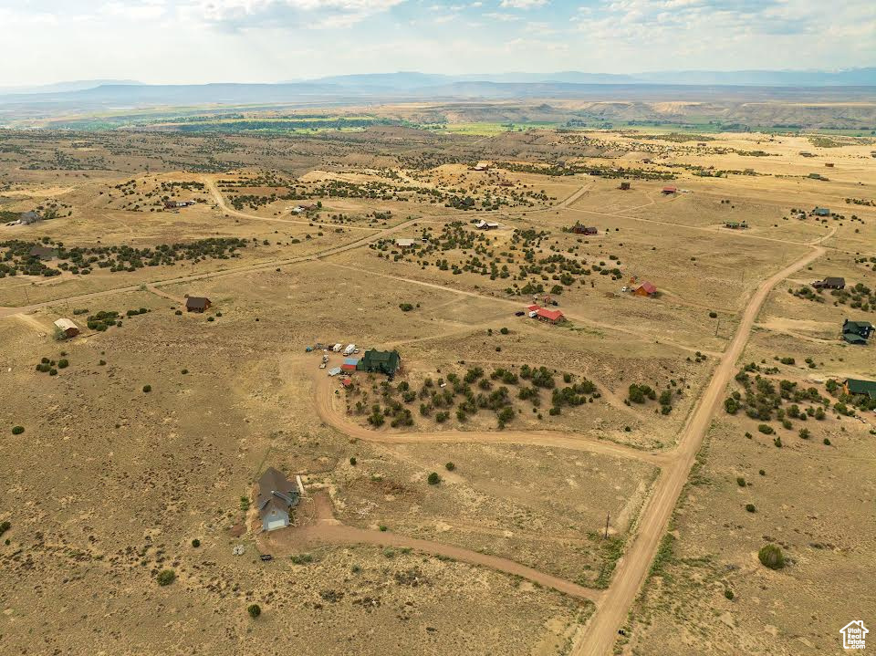 Birds eye view of property with a rural view