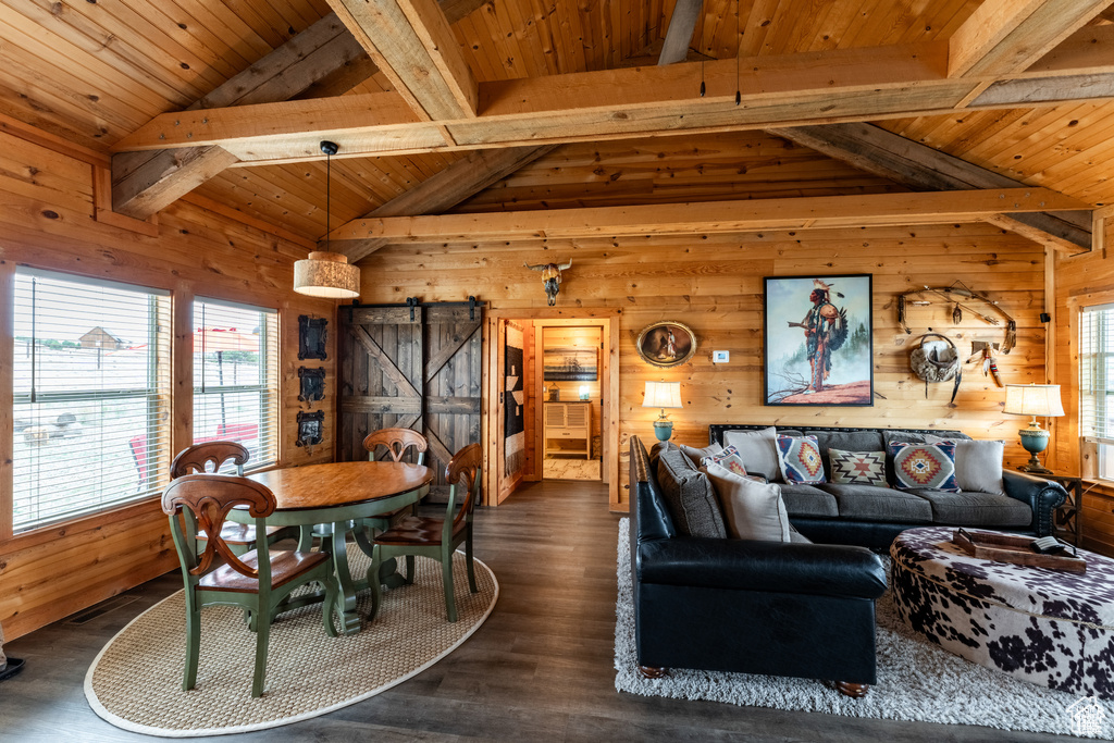 Living room with wood walls, dark hardwood / wood-style flooring, and wood ceiling