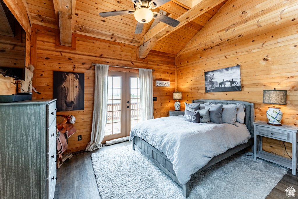 Bedroom featuring ceiling fan, dark wood-type flooring, access to exterior, and wood ceiling