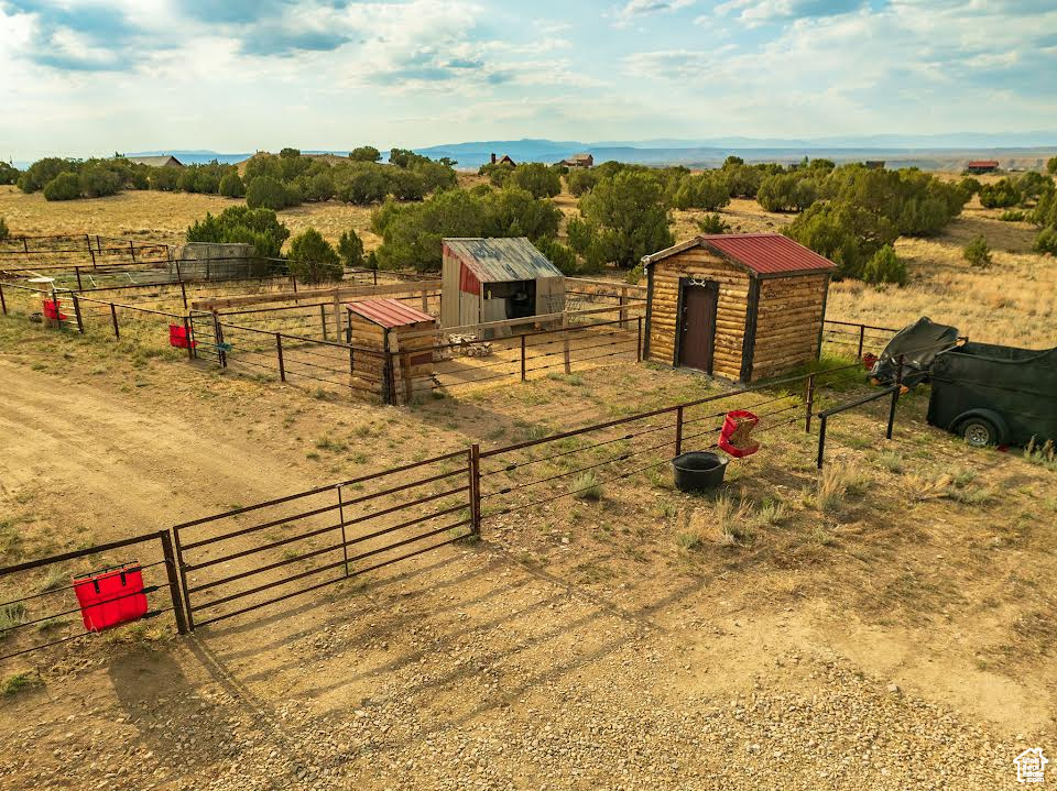 Exterior space with a rural view and a storage shed