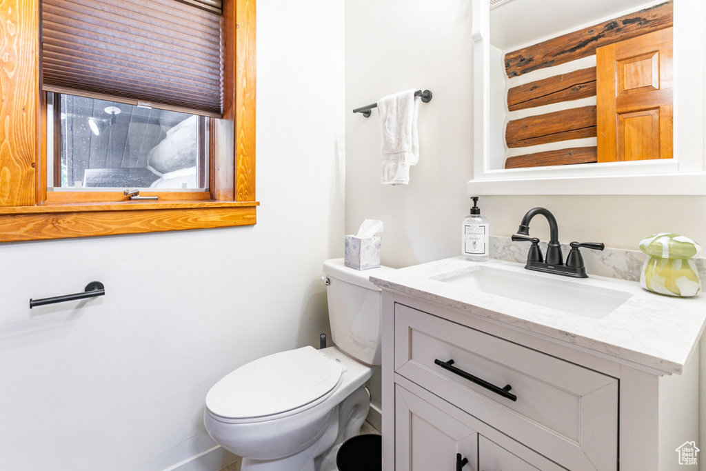 Bathroom with toilet and vanity