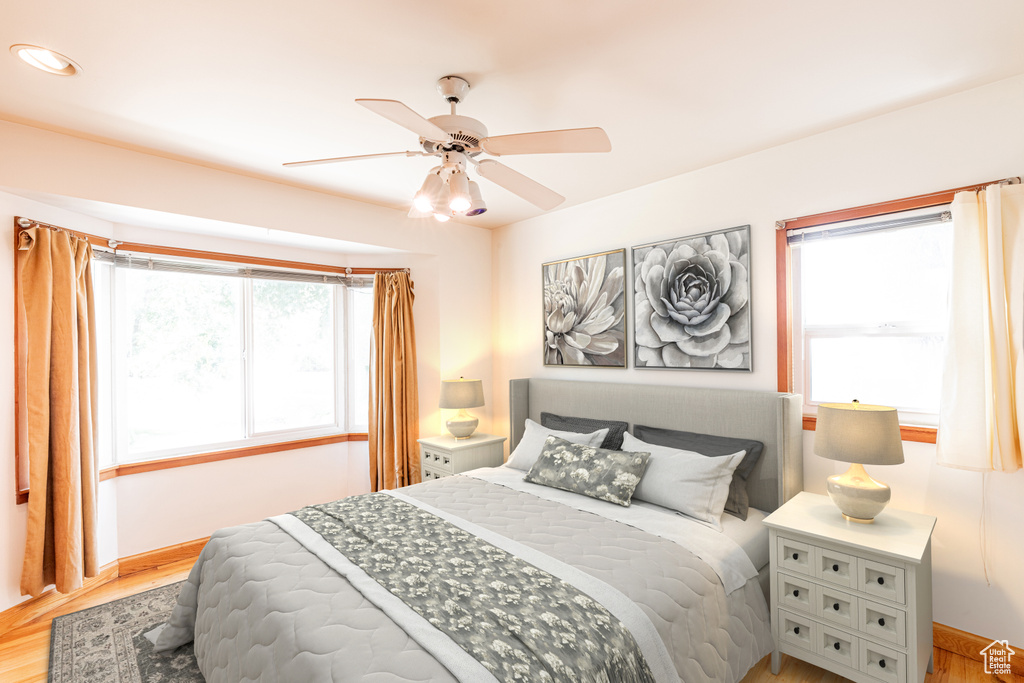 Bedroom featuring ceiling fan and light wood-type flooring