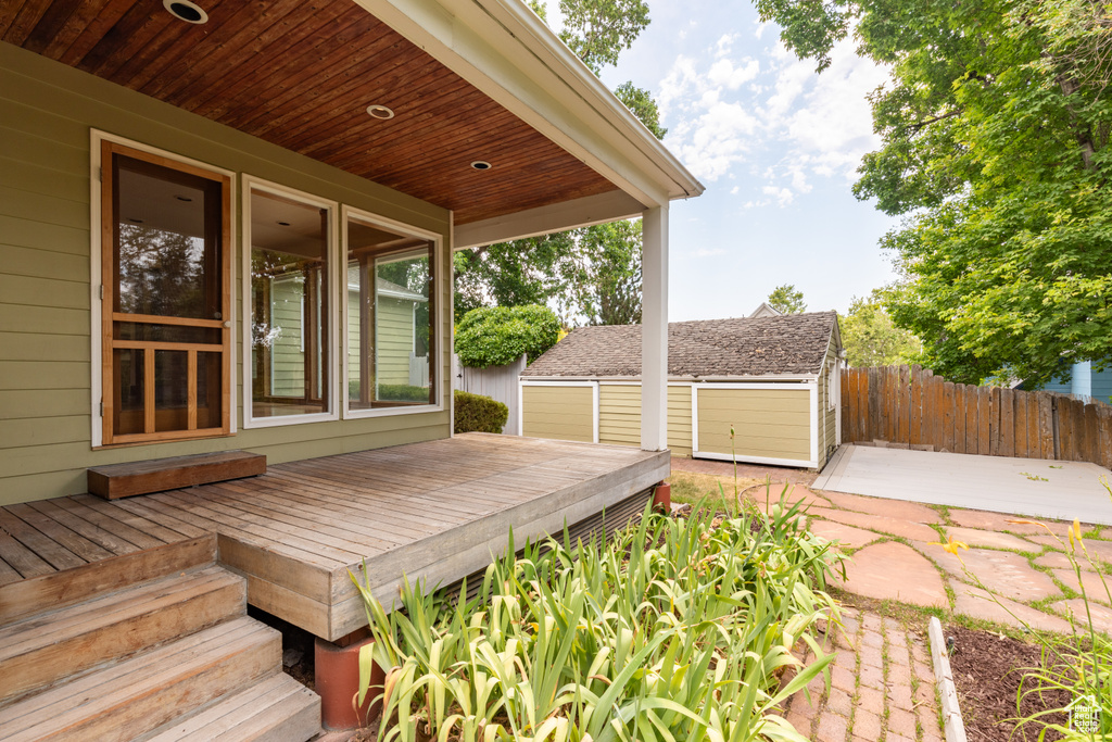 Wooden deck with a storage shed