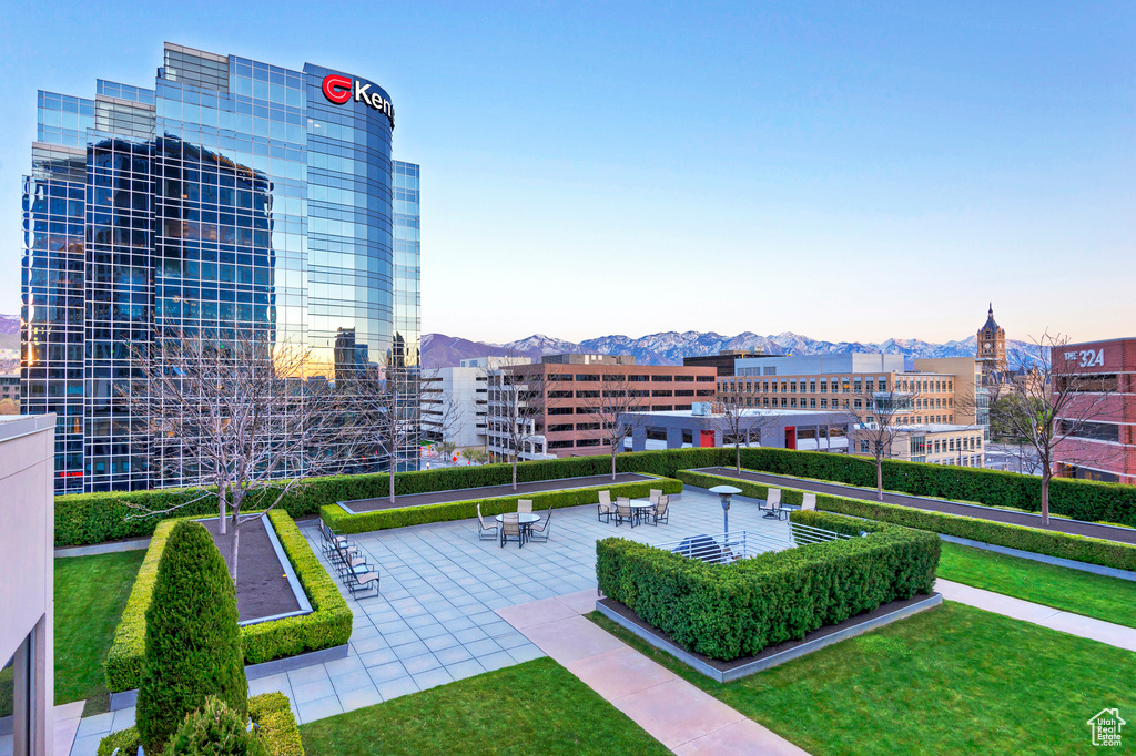 Exterior space featuring a lawn and a mountain view