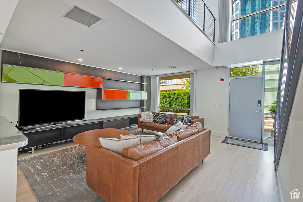 Living room with light hardwood / wood-style floors