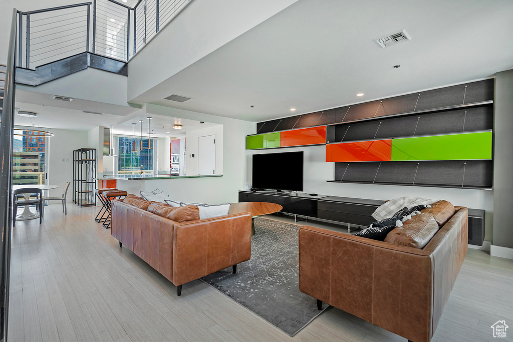 Living room with light wood-type flooring