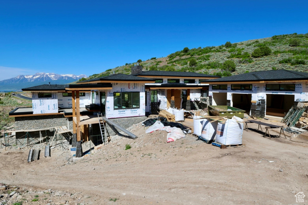 Rear view of property featuring a mountain view