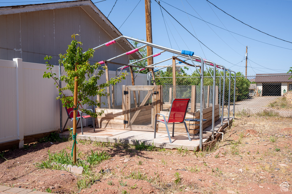 View of yard with an outbuilding and a patio area