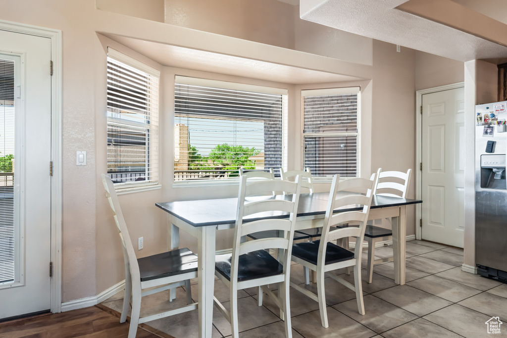 Dining area with light wood-type flooring