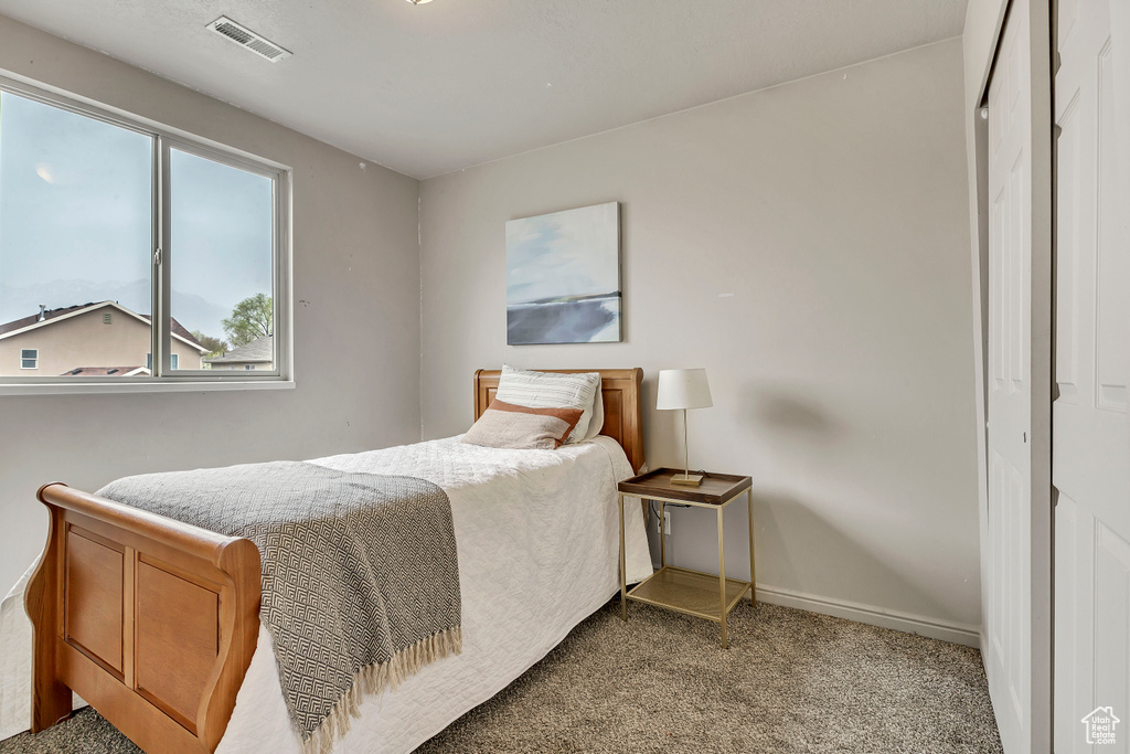 Bedroom featuring carpet