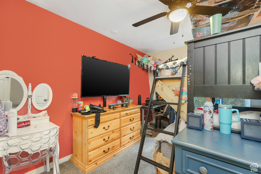 Bedroom with ceiling fan and carpet