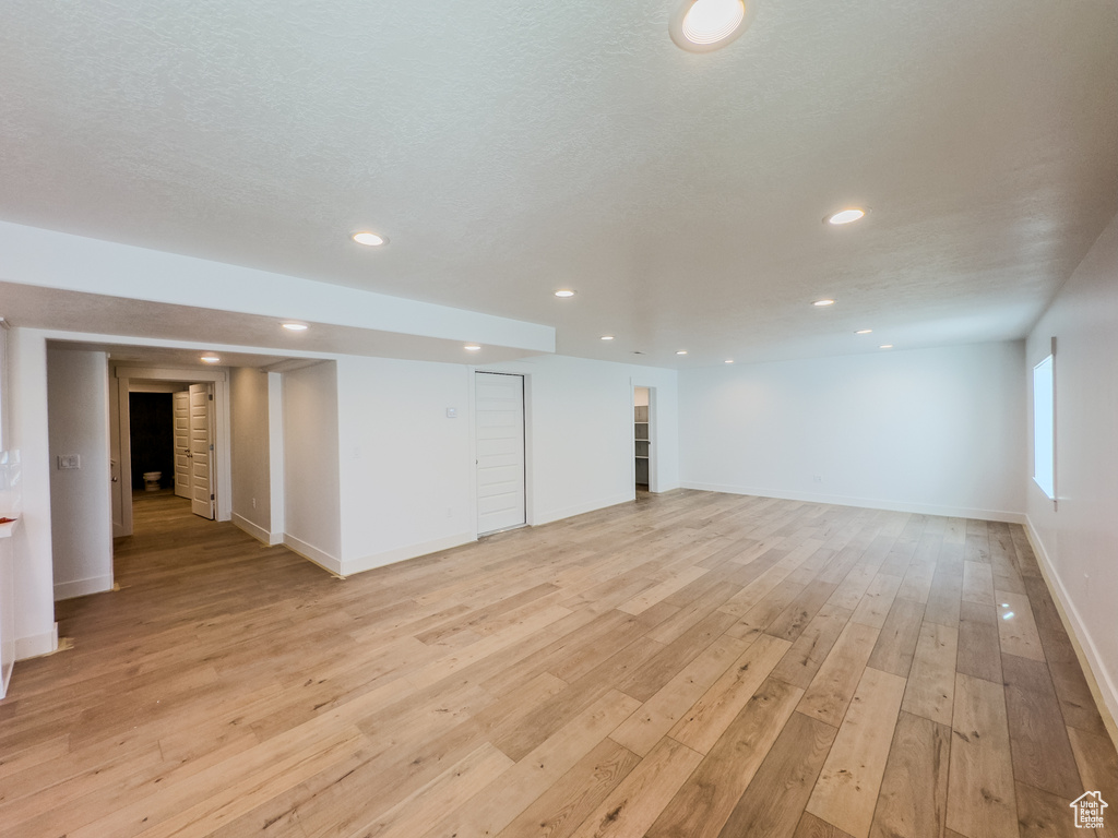 Spare room featuring light wood-type flooring