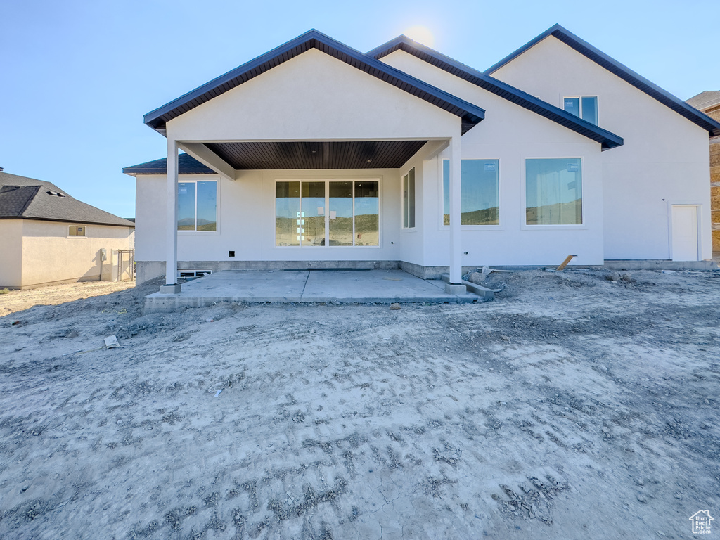 Rear view of property with a patio