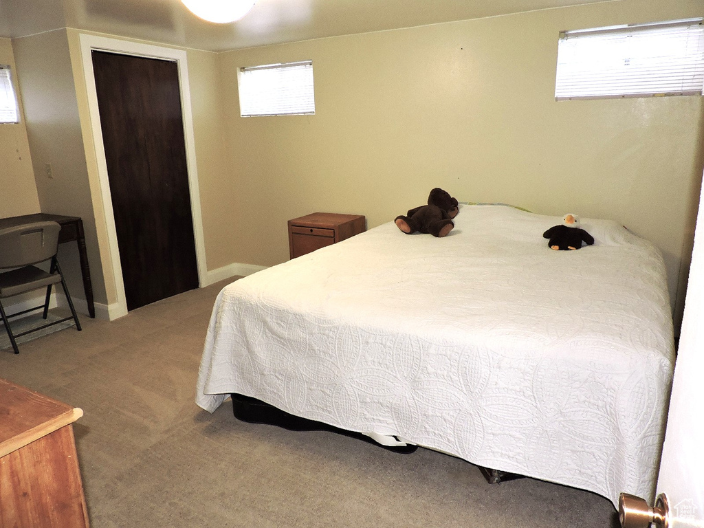 Bedroom featuring a closet and carpet floors