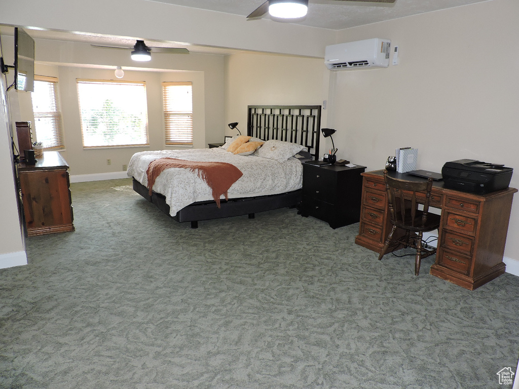 Bedroom featuring ceiling fan, a wall mounted AC, and carpet flooring