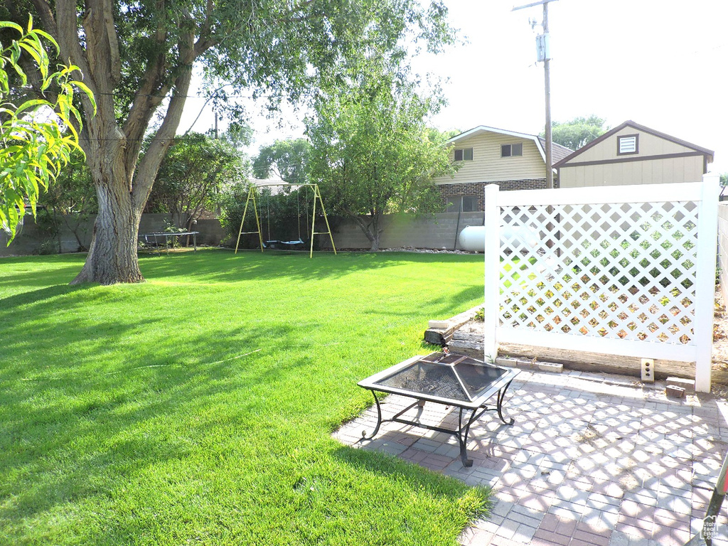 View of yard with a patio