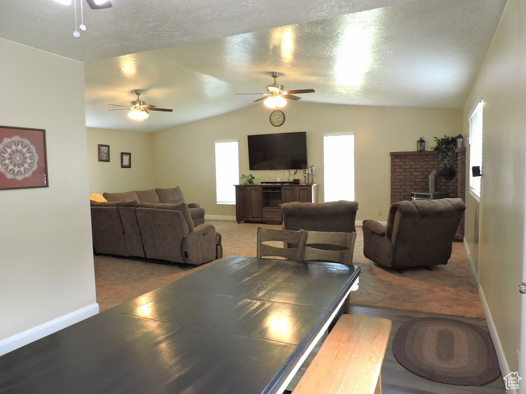 Living room featuring ceiling fan and carpet floors