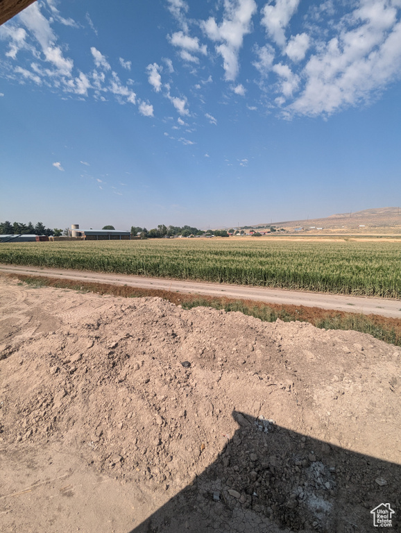 View of yard with a rural view