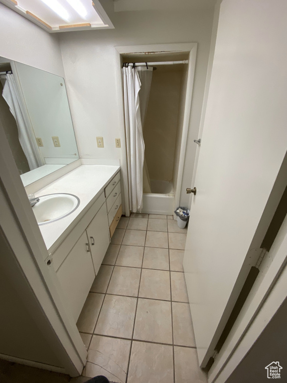 Bathroom featuring tile patterned floors and vanity