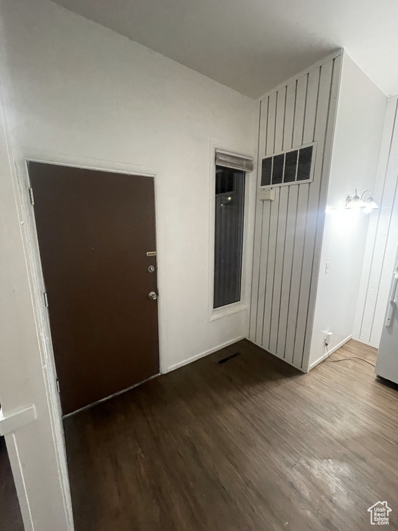 Empty room with hardwood / wood-style floors