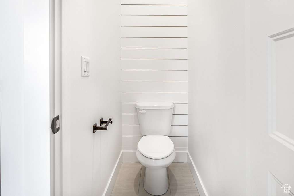 Bathroom with tile patterned floors and toilet