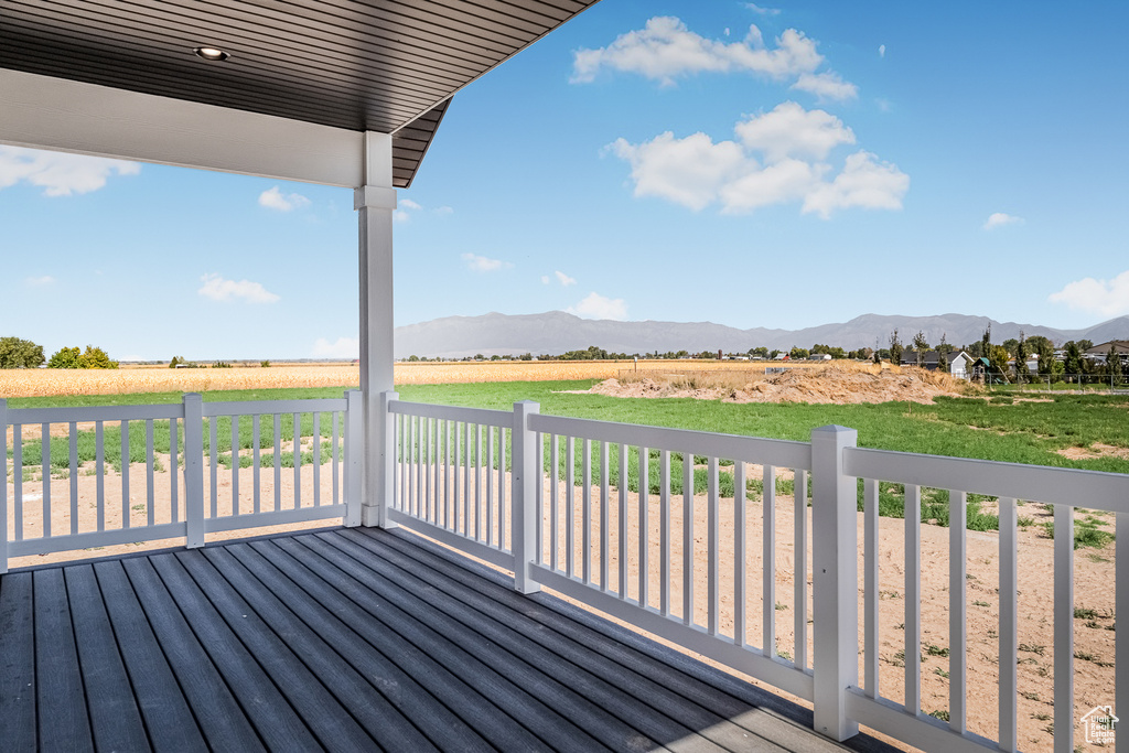 Wooden terrace with a lawn and a mountain view