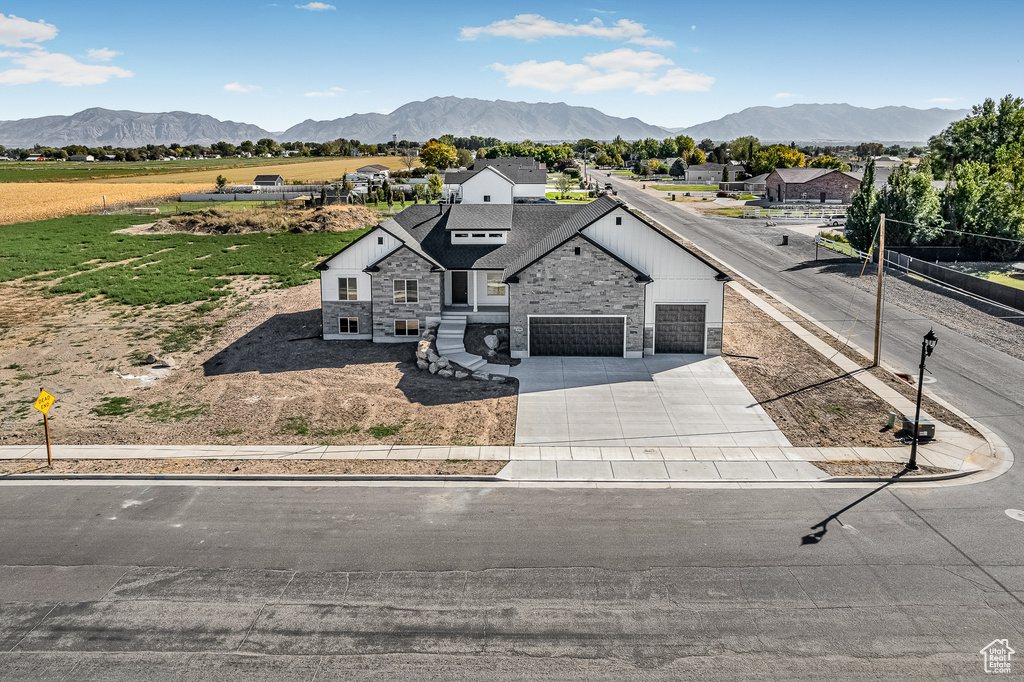 Exterior space featuring a mountain view and a garage