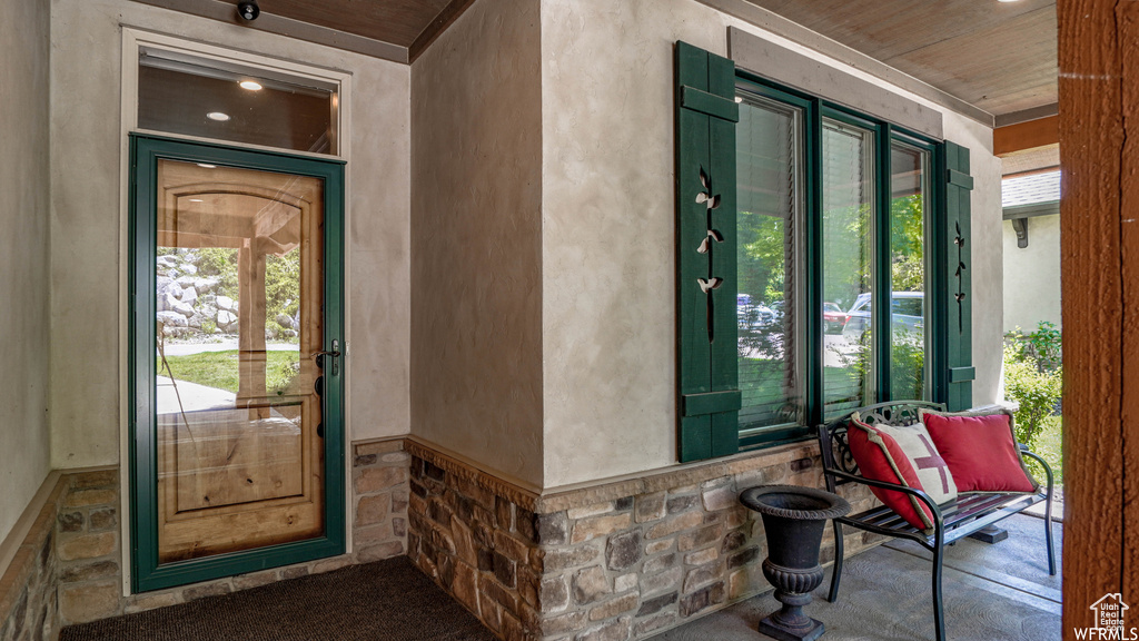 Property entrance with covered porch