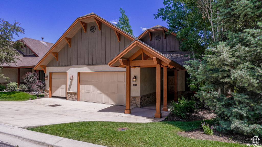 View of front facade featuring a garage