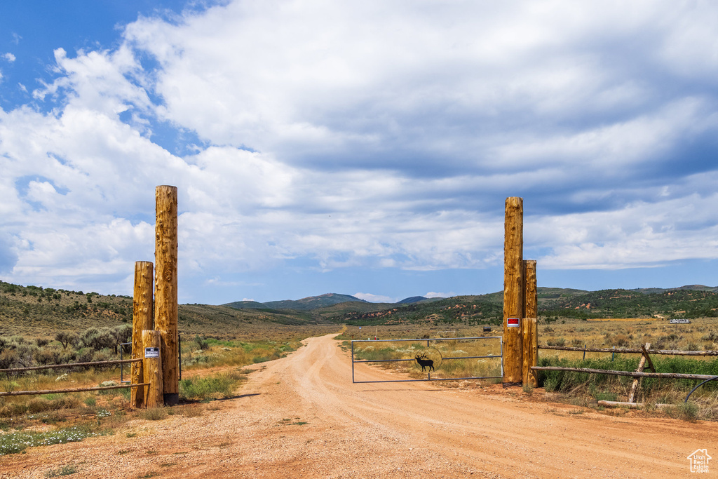 View of road with a rural view and a mountain view